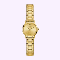 The Guess Watches GW0244L2 Gold Tone Stainless Steel Watch features a round face, minimalist dial with Swarovski crystal markers at 12, 3, 6, and 9 o’clock, and a linked bracelet—shown on a light purple background.