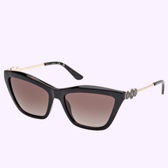 Guess Sunglasses GU00199 5652F (UPC 889214571304) feature a cat-eye shape, dark gradient lenses, black and tortoiseshell frames, gold temples, and stylish detailing near the hinges—a chic choice from Guess Sunglasses.