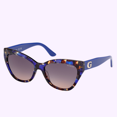 The Guess Sunglasses GU00204 5592F UPC 889214581464 feature stylish blue and tortoiseshell cat-eye frames, gradient lenses, and blue temples with a gold G logo and GUESS front print—perfect for a fashionable look.