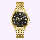 The Guess Watches GW0976G2 is a gold-tone multi-function wristwatch with a black dial, gold hour markers, Roman numeral XII, three subdials, and a recycled steel bracelet.