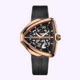 The Hamilton Elvis80 Skeleton Auto Men Watch H24525331 from Hamilton Watches features a black and rose gold PVD triangular case, black strap, skeleton dial revealing inner mechanisms, and both strap and dial with the Hamilton name.