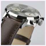 Close-up of the Hamilton Watches American Classic Intra-Matic Auto Chrono 40mm H38416560, featuring a panda dial, brown leather strap with detailed stitching, silver case, and side view showing crown and pushers.