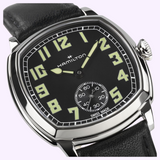 Hamilton American Classic Cushion Mechanical H36129730 watch with a black dial, luminous Arabic numerals, and a black leather strap.