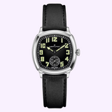 Hamilton American Classic Cushion Mechanical H36129730 watch featuring a cushion-shaped case, a black dial with large cream-colored numerals, and a black leather strap.