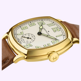Hamilton Watches American Classic Cushion Mechanical H36139520 cushion-shaped watch featuring a white dial with luminescent Arabic numerals and a brown leather strap.