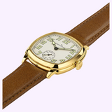 Hamilton Watches H36139520 American Classic Cushion Mechanical gold-tone cushion-shaped watch featuring an off-white dial, Arabic numerals, a sub-dial for seconds, and a brown leather strap.
