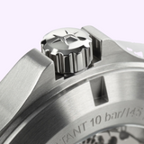 Close-up of the stainless steel crown with a star-shaped logo on a Hamilton Watches H64475560 Khaki Field King Day-Date, set between protective guards on a brushed metal case.