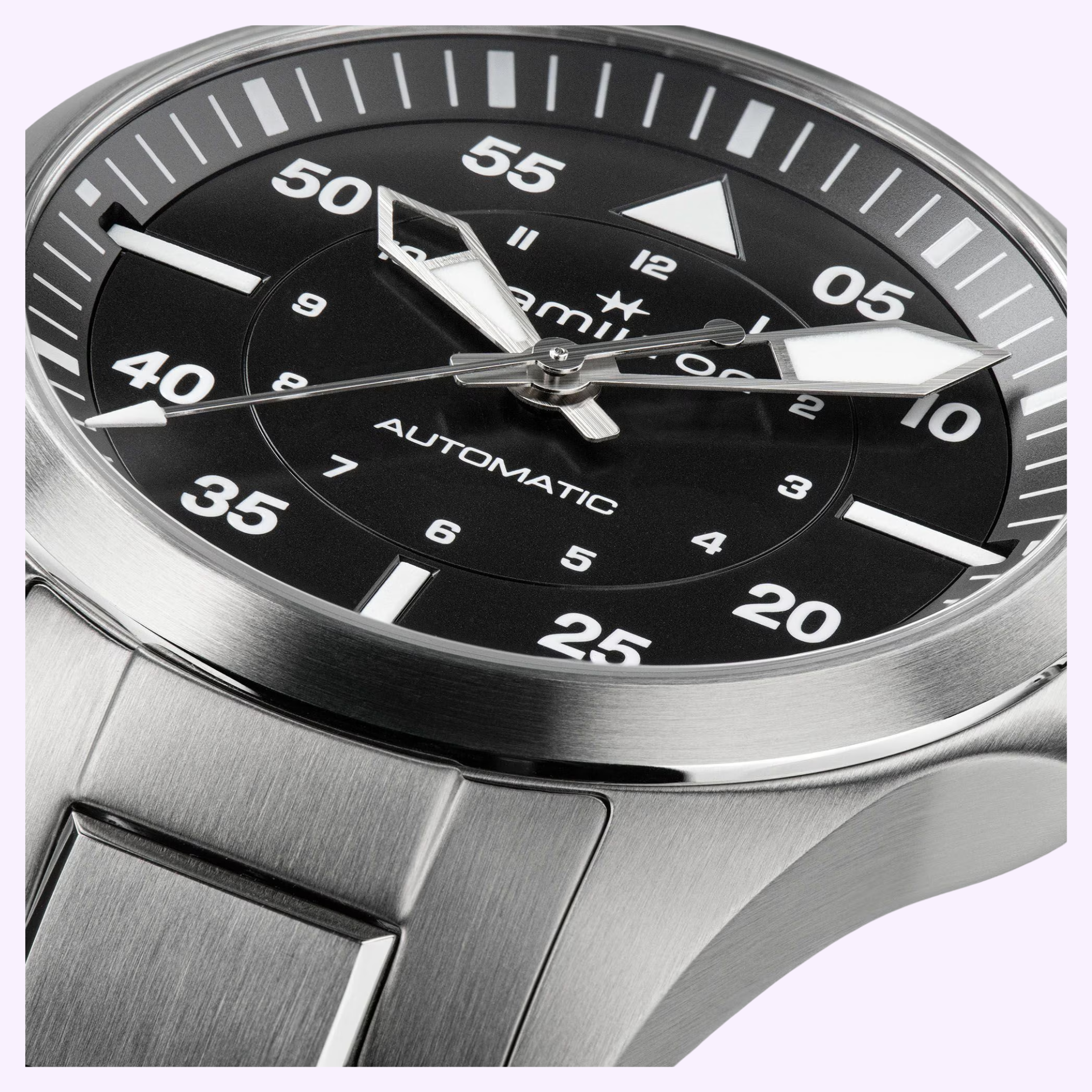 Close-up of the Hamilton Watches Khaki Aviation Pilot Auto H76215130, featuring a silver stainless steel case, metal band, black dial with bold white numerals, and large luminous hands—classic Hamilton Watches piloto 36mm design.