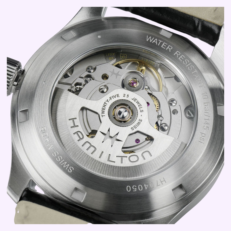 Close-up of the exhibition caseback of the Hamilton Khaki Field Murph 38mm H70405140 showing the H-10 automatic movement, gears, and Swiss Made engravings