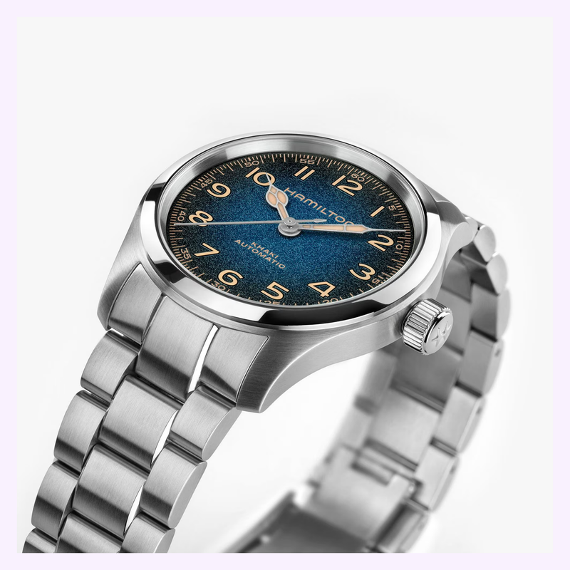 Angled view of the Hamilton Khaki Field Murph 38mm H70405140 showing the stainless steel case, blue-to-black textured dial, and Arabic numerals