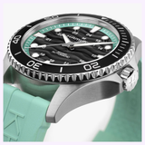 Close-up of the Hamilton Watches Khaki Navy Scuba 40mm H82415331 automatic dive watch, featuring a black and green dial, silver markers, rotating bezel, mint green rubber strap, and visible Hamilton logo on the dial and crown.