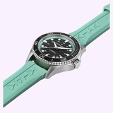 The Hamilton Watches Khaki Navy Scuba 40mm H82415331 features a silver case, black dial, turquoise rubber strap, rotating bezel, luminescent markers, and automatic dive watch performance.