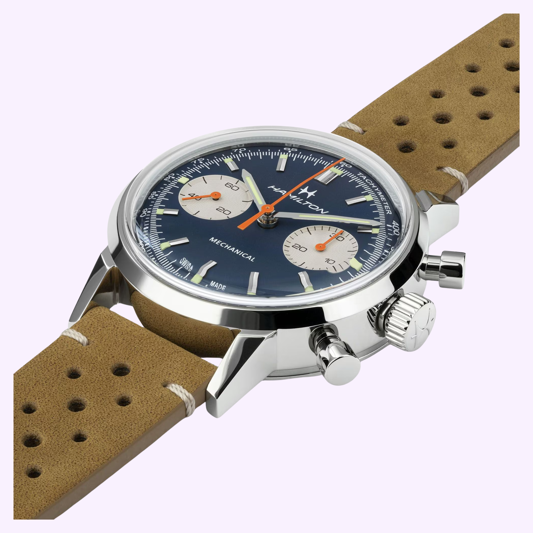 A close-up of the Hamilton Watches American Classic Intra-matic Chronograph H38429541 highlights its blue dial, silver case, orange second hand, two subdials, tan perforated leather strap, and the HAMILTON name on the face.