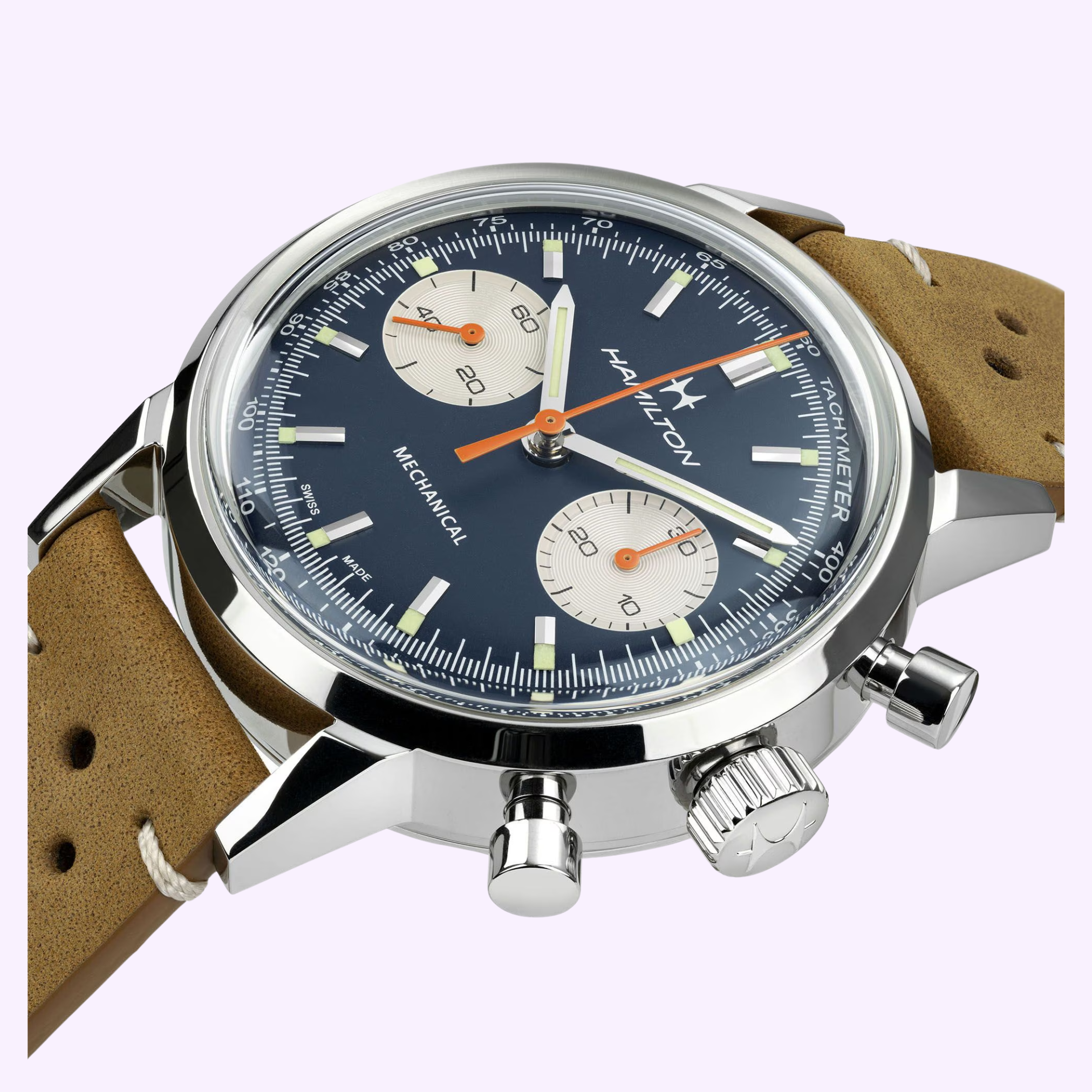 A close-up of the Hamilton Watches American Classic Intra-matic Chronograph H38429541: a 40mm mechanical watch with blue dial, two subdials, silver case, tan leather strap, white and orange accents, and sapphire crystal.