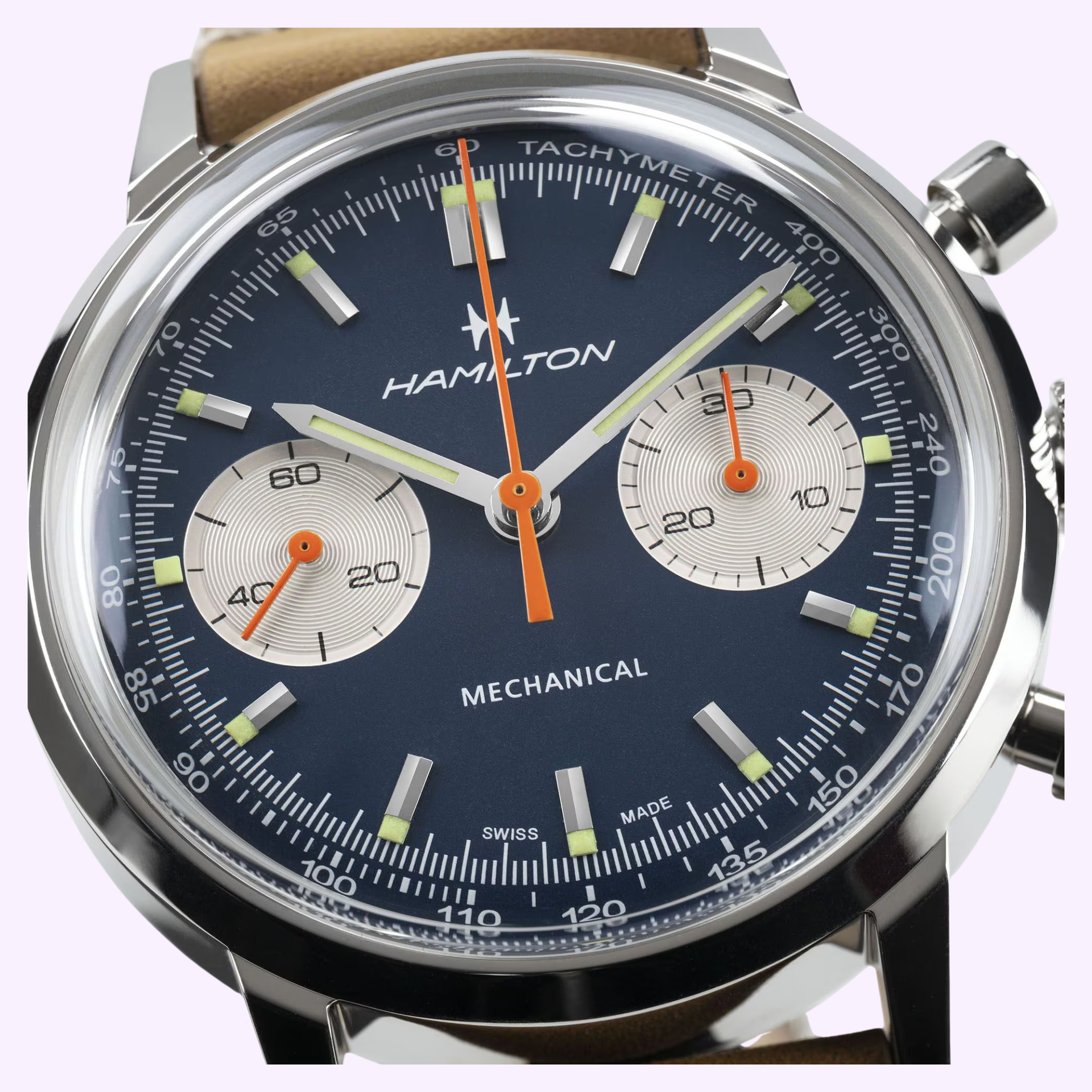 Close-up of the Hamilton Watches American Classic Intra-matic Chronograph H38429541, a 40mm mechanical watch with blue dial, two subdials, silver and orange hands, tachymeter bezel markings, and a brown leather strap.