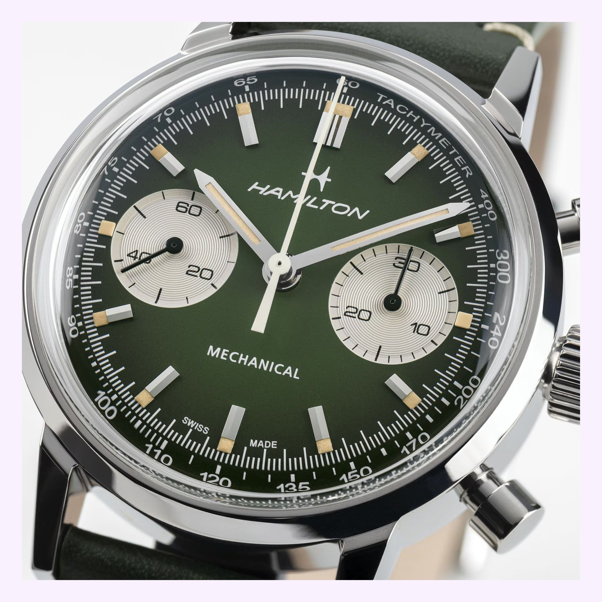 Close-up of the Hamilton Watches American Classic Intra-matic Chronograph H38429861, featuring a green dial with two white subdials, silver hour markers, tachymeter bezel, stainless steel case, and dark strap.