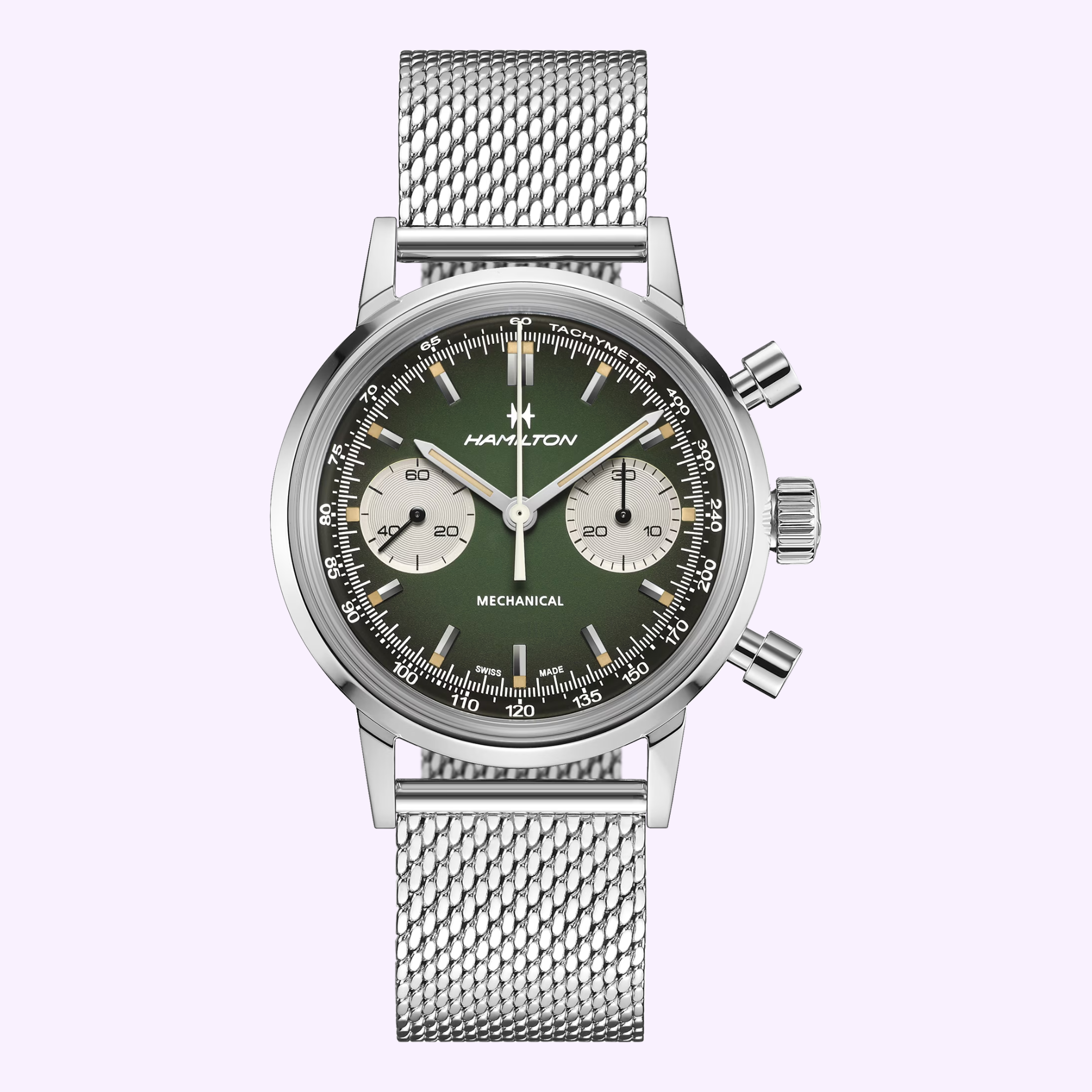 The Hamilton Watches American Classic Intra-matic Chronograph H38429861 features a silver mesh strap, green and black dial with two subdials, white hands and markers, displayed on a light purple background.