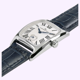 A close-up of a Hamilton Watches American Classic Boulton Small Second Quartz H13321611 women's luxury watch, featuring a silver rectangular case, white dial with black Roman numerals, blue hands, subdial, and an elegantly textured dark blue leather strap that highlights its Swiss quartz movement.
