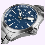 The Hamilton Watches Khaki Aviation Pilot Auto 39mm H76305140 features a stainless steel case, blue dial with white numerals, silver hands, star-engraved crown, metal link bracelet, and bold minute markers.