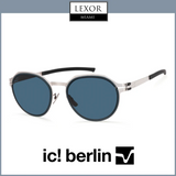 A pair of Ic! Berlin T 120 Ceramic Brutal Blue unisex sunglasses with round silver frames and dark blue lenses is shown on a light gray background, featuring the Lexor Miami and Ic Berlin Sunglasses logos.