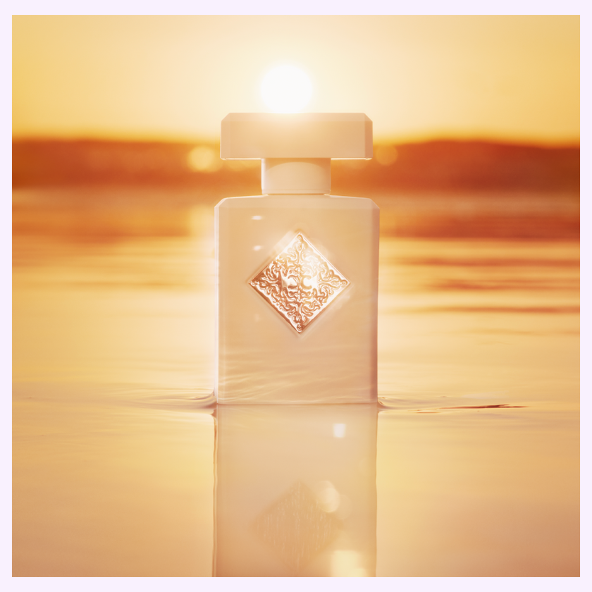A white perfume bottle with a diamond-shaped label stands in golden water, glowing in the sunset—an elegant nod to Initio Perfumes' LIFT ME UP EXTRAIT DE PARFUM 3.0 Oz women's fragrance.