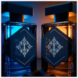 Two perfume bottles from Initio Perfumes are displayed side by side: one illuminated blue and the other orange, featuring ornate labels and modern square caps, highlighting INITIO Parfums Prives SUGAR BLAST EDP 3.0 Oz Unisex Perfume’s gourmand allure.