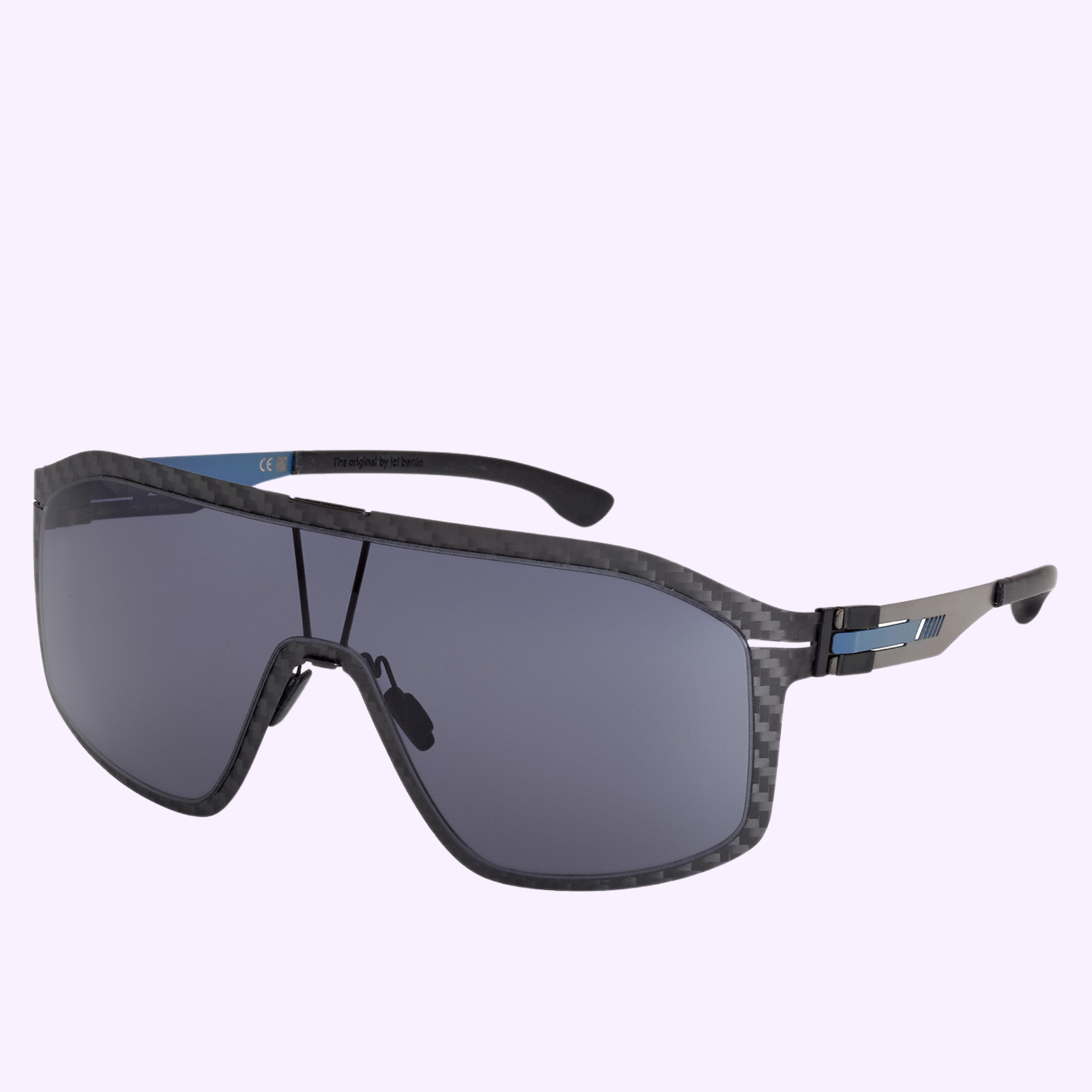 The Ic! Berlin Sunglasses IA0008 0002A by Ic Berlin Sunglasses feature a black carbon fiber frame, blue arm accents, and dark tinted lenses, shown on a light purple background—offered by an authorized Miami dealer.