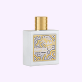 A white bottle with a gold cap and decorative label reading LATTAFA QAED AL FURSAN UNLIMITED 3.0 oz EDP Unisex Perfume by Lattafa Perfumes, displayed on a light purple background.