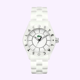 The Lacoste LC2000672 Biarritz Ceramic Crystal women’s watch features a round white face, silver hour markers, the iconic green crocodile logo, "Lacoste" on the bezel, and a stylish white strap. Brand: Lacoste Watches.