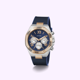 The Guess Watches Mens Blue 2-Tone Multi-function GW0791G2 features a blue leather strap, gold and silver-tone bezel, blue dial with gold Roman numerals and three subdials, shown on a light purple background. Fashion meets function in this stylish timepiece.