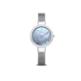 The Bering Watches Classic 16831-004 is a women's polished silver stainless steel watch with a silver mesh band, light blue mother-of-pearl dial, minimalist markers, and slim crystal-encrusted bezel—displayed on a white background.