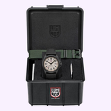 The Luminox Watches Atacama Field XL.1971.SET features a 43mm CARBONOX case, green fabric strap, tool, and comes in a foam-lined black box with Luminox Watches branding on the lid and front panel.