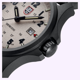 Close-up of the Luminox Watches Atacama Field XL.1971.SET, showcasing its textured beige dial, black hour markers, luminescent hands, date window at 31, and the robust CARBONOX case with crown visible.