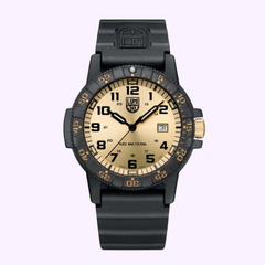 The Luminox Watches Leatherback Sea Turtle Giant XS.0325.GP (UPC: 7611382637741) features a black case, beige face with black numerals, date display, black bezel, and a durable black rubber strap on a light purple background.