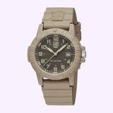 The Luminox Watches Leatherback Sea Turtle Giant XS.0326 features a round black dial with white numerals, date display, beige rubber strap, Luminox logo, and Swiss Made quartz movement by Luminox Watches, shown on a light background.