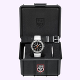 The Luminox Watches MIL-SPEC XL.3359.SET features a black military dive watch with two straps (black and white velcro) in an open black Luminox case with foam lining, 300m water resistance, and a small metal tool included.