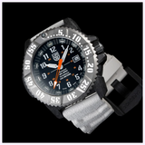 The Luminox Watches MIL-SPEC XL.3359.SET is a rugged military dive watch with a black/silver bezel, white numerals, black dial, orange and white hands, date display, and thick grey strap shown on a black background.