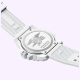 A close-up of the Luminox Watches Navy SEAL 3500 XS.3507.WB shows its white caseback with an embossed eagle, anchor, and trident insignia, plus engraved text—an iconic military dive watch by Luminox Watches.