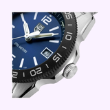 Close-up of a Luminox Watches Pacific Diver Ripple XS.3123M.SET.1 silver wristwatch with a blue face, white hands and markers, date window, black bezel marked "200 METERS," visible crown, part of the metal band, and self-powered illumination.