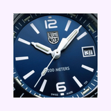 Close-up of a blue Luminox Watches Pacific Diver Ripple XS.3123M.SET.1 face with white hour markers, hands, date (31), “200 METERS” and “SWISS MADE” text, plus self-powered illumination. Brand: Luminox Watches. UPC: 7611382654717.