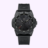The Luminox Watches Pacific Diver XS.3121.BO.1 is a black sports wristwatch with a rubber strap, textured bezel, bold hour markers, self-powered illumination, date window at 3 o’clock, and the Luminox Watches logo below 12 o’clock.