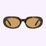 The MARC JACOBS Sunglasses MARC 887/G/S 086 HVN feature brown oval lenses with tortoiseshell frames and amber-tinted lenses, showcased from the front against a light purple background. These sunglasses by MARC JACOBS Sunglasses epitomize modern style with a luxurious touch.
