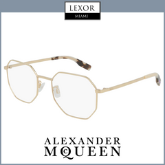 Gold geometric MCQ MQ0317O 003 54 unisex optical frame by MCQ Sunglasses, with clear lenses and tortoiseshell tips, displayed diagonally on a white background. Lexor Miami and MCQ logos appear above and below the glasses.
