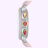 Side view of the MICHELE Watches SPORTY SPORT SAIL MWW01P000023 with a light pink strap, silver case, two gold buttons, and a gold crown with red accent and MW initials on a pale purple background. Brand: Michele Watches.