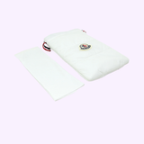 White quilted drawstring pouch for Moncler Diffractor ML0206 24C 66 Unisex Injected Sunglasses, shown alongside a folded white cleaning cloth.