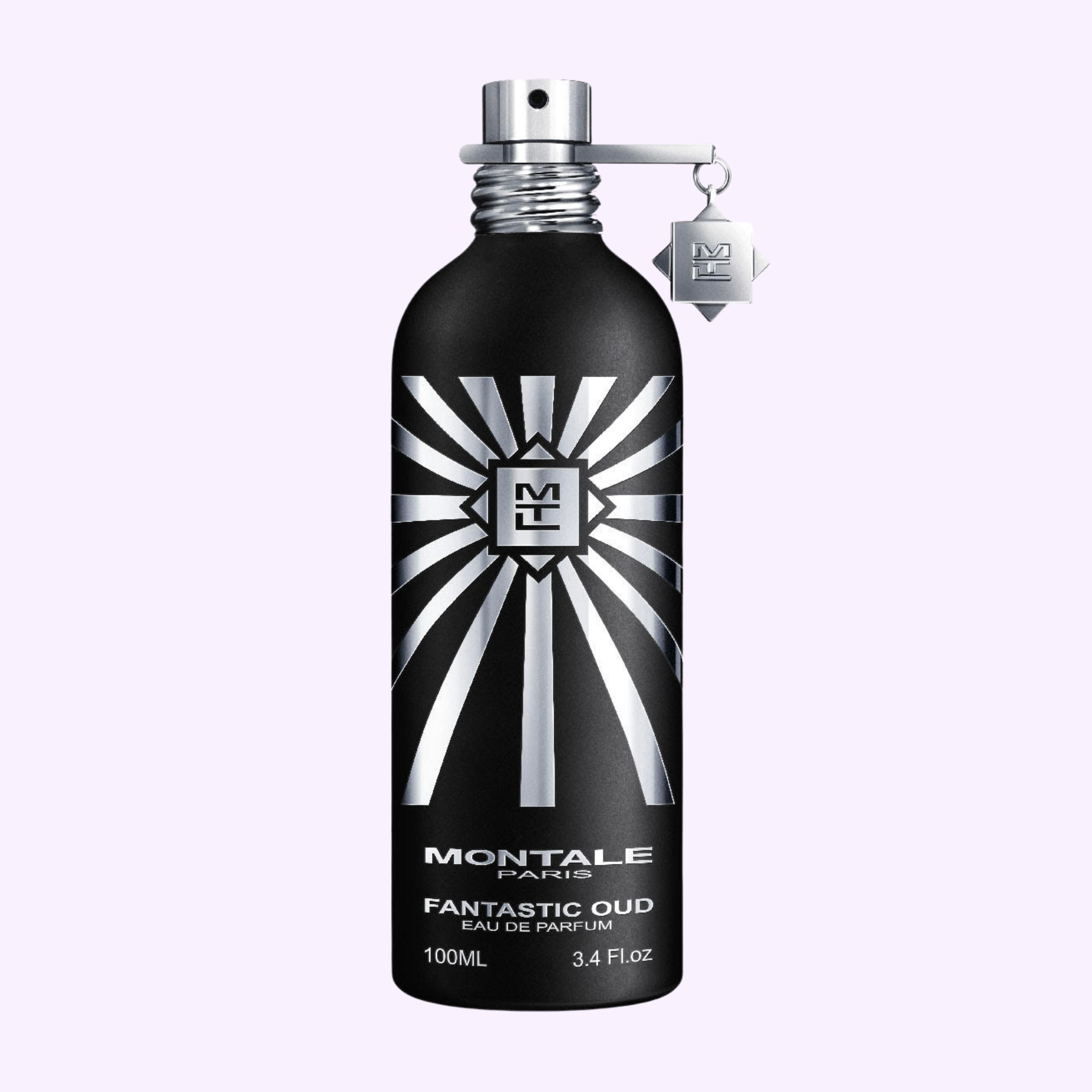 A black Montale Perfumes bottle labeled MONTALE Fantastic Oud EDP 3.4 Oz features a silver sunburst, metallic spray cap, and silver tag. This oud perfume is set against a light purple background.