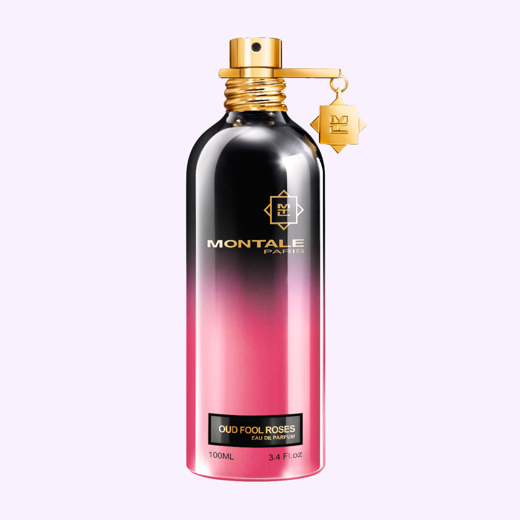 A metallic pink and black Montale Perfumes bottle labeled MONTALE Oud Fool Roses EDP 3.4 Oz with a gold cap and charm stands upright against a pale lavender background, capturing the signature elegance of Montale’s scent collections.