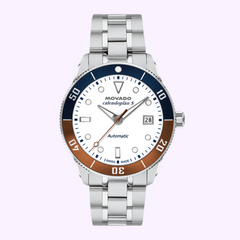 The MOVADO WATCHES Heritage Series Calendoplan S Automatic 3650222 features a silver case, white dial, date display, and blue/brown bezel on a metal bracelet. This Swiss-made watch exudes timeless elegance against a light purple background.