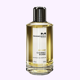 A 4.0 oz clear bottle of Mancera Intense Cedrat Boise EDP for women by Mancera Perfumes, filled with light yellow liquid, is displayed against a plain light background.