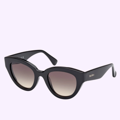 Max Mara Sunglasses MM0077 5001B (UPC 889214470683) are shown against a plain light background. These black cat-eye sunglasses feature gradient lenses and a bold, thick frame with pointed edges, accented by a small Max Mara logo on the temple—an ideal choice for anyone seeking women’s designer eyewear that fuses contemporary elegance with exceptional Italian luxury craftsmanship.